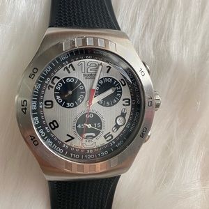 Men swatch Swiss irony stainless steel. The clock's second hand doesn't move.